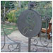 Elegant wrought iron gates invite you into this yard.